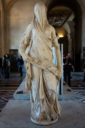 veiled woman at the louvre paris