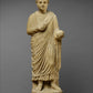 limestone statue of a wreathed boy holding a ball or piece of fruit