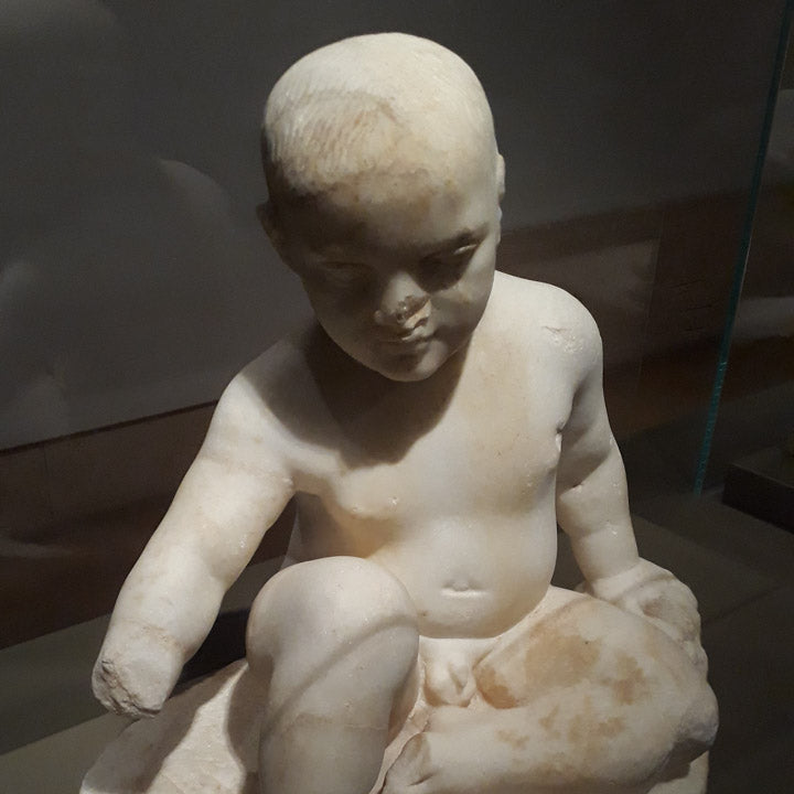 statuette of a child