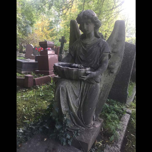 angel holding a bowl from highgate cemetery